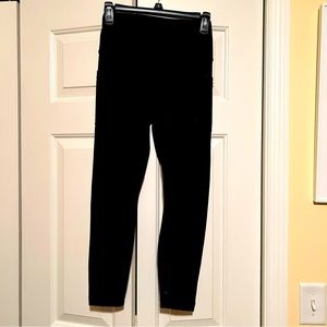 Black leggings with side pockets, size small.